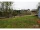 View of the spacious and grassy backyard at 2225 Grace Church Rd, Salisbury, NC 28147