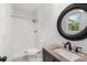 Bathroom featuring a new vanity, toilet, and shower with white tile surround at 2225 Grace Church Rd, Salisbury, NC 28147