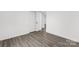 Bedroom featuring durable flooring, closet, and open door to another room at 2225 Grace Church Rd, Salisbury, NC 28147