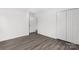Bedroom featuring durable flooring, closet, and open door to another room at 2225 Grace Church Rd, Salisbury, NC 28147