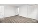 Spacious bedroom featuring durable flooring, closet, and open door to bathroom at 2225 Grace Church Rd, Salisbury, NC 28147