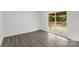 Bedroom with light gray flooring and access to an outdoor wooden deck through a glass sliding door at 2225 Grace Church Rd, Salisbury, NC 28147