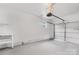 View of garage space featuring new floor paint, shelving, and white walls at 2225 Grace Church Rd, Salisbury, NC 28147