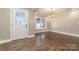 Entryway with hardwood floors, crown molding, a decorative door and a chandelier in the dining area at 24 Eastwinds Dr, Hickory, NC 28601