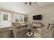 Cozy living room featuring vaulted ceilings, a comfortable sofa, and ample natural light from the window at 24 Eastwinds Dr, Hickory, NC 28601