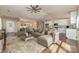 Open-concept living room showcasing kitchen with white cabinets, island, and comfortable seating area at 24 Eastwinds Dr, Hickory, NC 28601