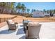 Spacious backyard featuring a comfortable patio set, perfect for entertaining and enjoying the outdoors at 242 Hamptons Cove Rd, Troutman, NC 28166