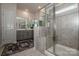 Modern bathroom featuring a glass enclosed shower, neutral tile, and a double sink vanity at 242 Hamptons Cove Rd, Troutman, NC 28166