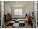 Bright bonus room with french doors, modern flooring, and ample space at 242 Hamptons Cove Rd, Troutman, NC 28166