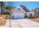 Charming single-Gathering home with a two-car garage, stone accents, and well-maintained landscaping at 242 Hamptons Cove Rd, Troutman, NC 28166