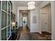 Inviting hallway with hardwood floors, modern lighting, and stylish decor at 242 Hamptons Cove Rd, Troutman, NC 28166