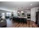 Beautiful kitchen featuring stainless steel appliances, pendant lighting, and a large center island with bar seating at 242 Hamptons Cove Rd, Troutman, NC 28166