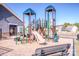 Community playground with slide, climbing structure, benches, and picnic tables at 242 Hamptons Cove Rd, Troutman, NC 28166