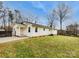 Backyard view of this home with an attractive lawn and mature trees at 279 Timberland Loop, Mooresville, NC 28115