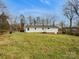 Large backyard provides ample space and privacy, ideal for recreation and outdoor enjoyment at 279 Timberland Loop, Mooresville, NC 28115