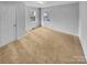 Neutral bedroom featuring plush carpet, a double hung window, and a closet for ample storage at 279 Timberland Loop, Mooresville, NC 28115