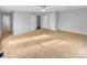 Neutral bedroom showcasing plush carpet, a ceiling fan, and closets for ample storage at 279 Timberland Loop, Mooresville, NC 28115