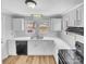 Bright kitchen featuring white cabinetry, modern appliances, and a clean aesthetic at 279 Timberland Loop, Mooresville, NC 28115