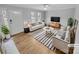 Bright and inviting living room with neutral tones and stylish contemporary furniture at 279 Timberland Loop, Mooresville, NC 28115