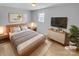 Cozy main bedroom with a comfortable bed, soft lighting, and minimalist decor at 279 Timberland Loop, Mooresville, NC 28115