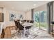 Elegant dining room with a large table, stylish chairs, and a sliding glass door to the backyard at 2946 Legacy Ridge Ln, Catawba, NC 28609