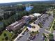 Aerial view of community clubhouse featuring pool, parking, and nearby lake at 3052 Santee Ct, Indian Land, SC 29707