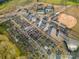 Aerial view showcasing community garden, tennis courts, baseball field, and parking at 3052 Santee Ct, Indian Land, SC 29707
