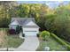 A lovely home featuring mature trees, a well-manicured lawn, and a two-car garage at 3052 Santee Ct, Indian Land, SC 29707