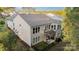 Two-story home with balcony, patio, fenced yard, and neutral siding at 3052 Santee Ct, Indian Land, SC 29707