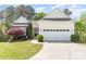 Charming single-Gathering home with a well-manicured lawn, mature trees, and a two-car garage at 3052 Santee Ct, Indian Land, SC 29707