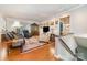 Comfortable living room boasts hardwood floors, a cozy seating area, and plenty of natural light at 3052 Santee Ct, Indian Land, SC 29707