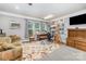 A well lit and decorated living space provides areas for work and relaxing at 3052 Santee Ct, Indian Land, SC 29707