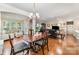 Open-concept living and dining area with hardwood floors and lots of natural light at 3052 Santee Ct, Indian Land, SC 29707