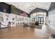 Elegant lobby featuring hardwood floors, comfortable seating, and large windows with natural light and American flags at 3052 Santee Ct, Indian Land, SC 29707