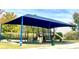 Community playground with various play structures, slide, swings, and seating benches at 3052 Santee Ct, Indian Land, SC 29707