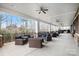 Inviting covered porch with comfortable seating and ceiling fans overlooking a wooded area at 3052 Santee Ct, Indian Land, SC 29707
