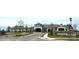 Front view of 'The Lodge' with well-maintained landscaping and a welcoming entrance at 3052 Santee Ct, Indian Land, SC 29707