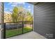 A modern balcony with metal railings overlooking a green lawn and trees at 3655 Vallette Ct, Charlotte, NC 28203