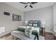 Bedroom features decorative accent wall, hardwood floors, soft textures, and lots of light at 3655 Vallette Ct, Charlotte, NC 28203