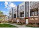 Contemporary townhome exteriors showcasing brick and neutral-colored siding with ample windows at 3655 Vallette Ct, Charlotte, NC 28203