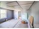 Bedroom showcasing needed ceiling and flooring repairs, and a window at 405 Link St, Fort Mill, SC 29715