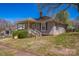 Charming single-story home with a covered front porch and well-maintained lawn at 405 Link St, Fort Mill, SC 29715