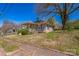 Charming one-story home with a cozy front porch and mature trees, offering great curb appeal at 405 Link St, Fort Mill, SC 29715