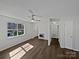 Bright living room with luxury vinyl plank flooring, a ceiling fan, and a heater at 426 W Ballard St, Cherryville, NC 28021