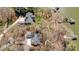 Aerial view of a sprawling property with lush trees and a pathway leading to the waterfront at 4633 River Bluff Ct, Charlotte, NC 28214