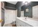 Bathroom featuring shower-tub combo, a large mirror, and dark blue walls at 4633 River Bluff Ct, Charlotte, NC 28214