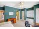 Bedroom featuring teal walls, neutral carpet, a window and an open ensuite bathroom at 4633 River Bluff Ct, Charlotte, NC 28214
