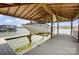 Covered boat lift protecting a boat and providing waterfront access at 4633 River Bluff Ct, Charlotte, NC 28214