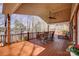 Spacious wooden deck featuring various seating options and views of the lake at 4633 River Bluff Ct, Charlotte, NC 28214