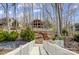 Lakeside home with a private dock and stunning water views framed by trees at 4633 River Bluff Ct, Charlotte, NC 28214